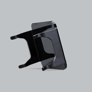 Black DX4 blackout cover seen edge on from behind, showing the depth of the skirts and the clips that hook over the light housing