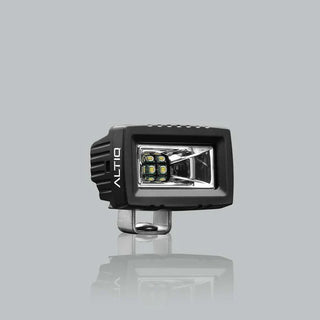 ALTIQ CX2 work light face on, the ALTIQ name on the left cheek of the housing and the rectangular reflector with its LED cluster and clear lens