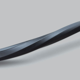 A length of the black wire concealer curved across the frame, showing how the flexible moulding follows a bend