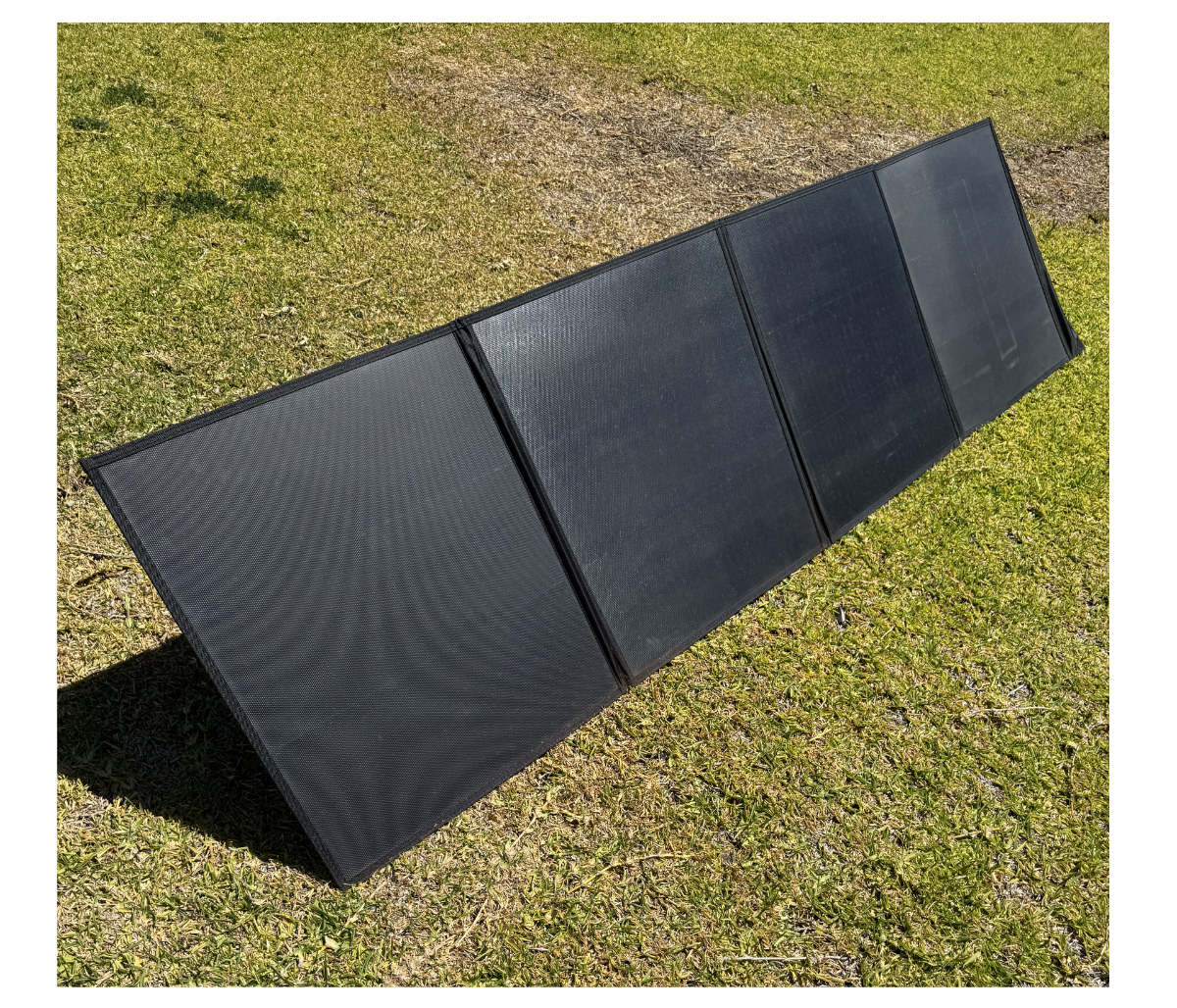 Foldable solar panel on a grassy background