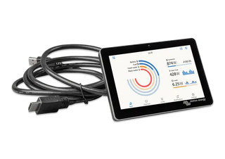 Tablet with energy monitoring app displaying graphs and numbers on a white background