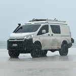 White van on a rainy landscape