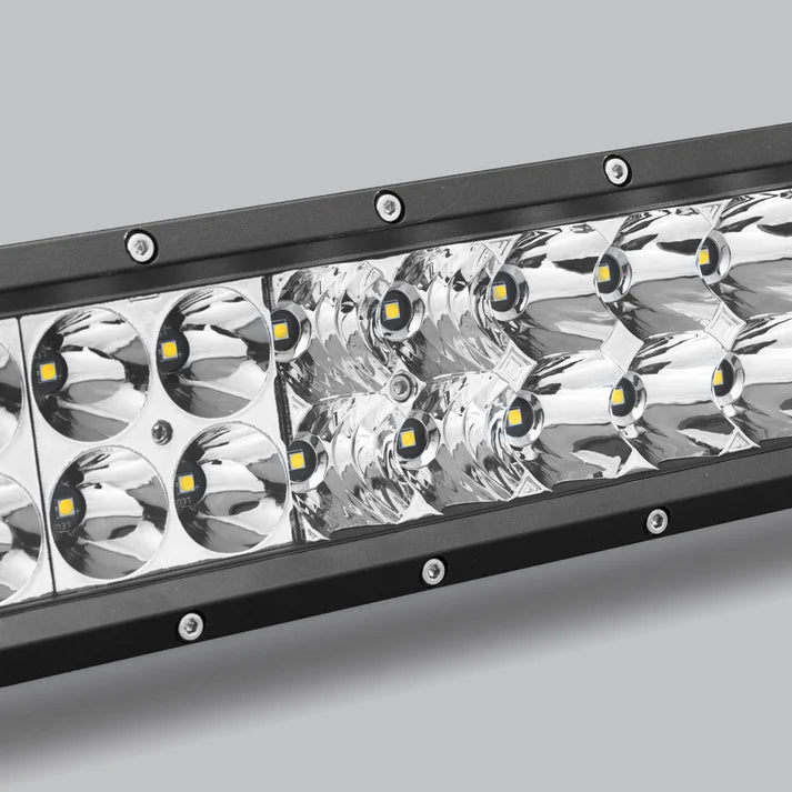 Close-up of the double row bar at an angle, showing where the round spot optics meet the rectangular flood block and the screws along the bezel