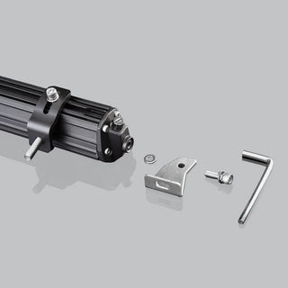End of the hybrid light bar with its mounting hardware laid out beside it: a stainless bracket, washer, socket bolt and the Allen key supplied to fit them