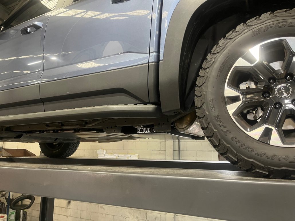 Car on a lift in a garage setting