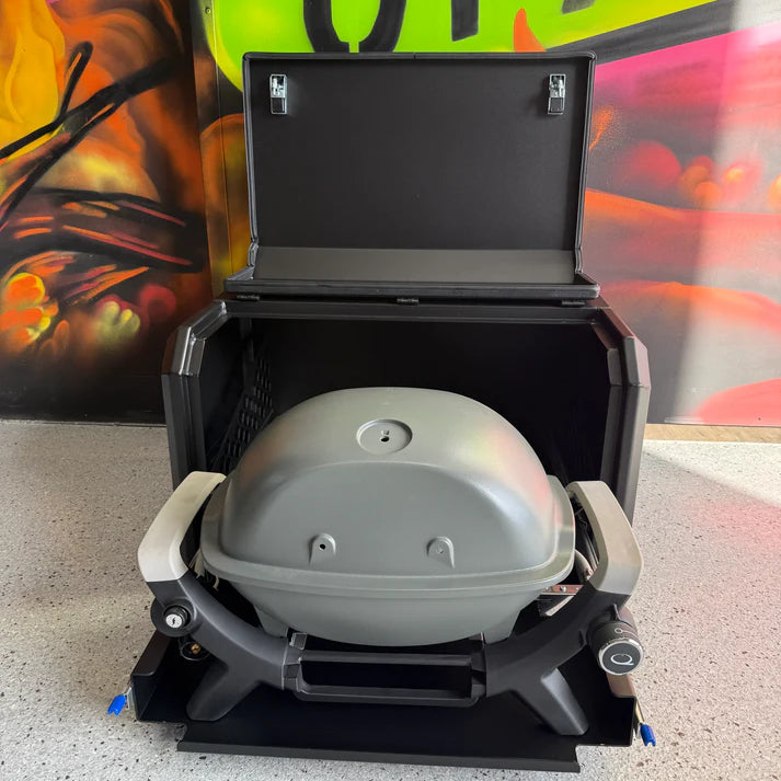 Portable grill on a speckled surface with colorful background