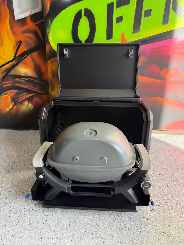 Portable grill on a speckled surface with colorful background