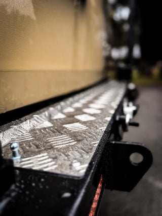 Metallic surface with geometric patterns on a blurred background
