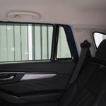 Car interior with a sunshade covering the rear window