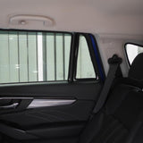 Car interior with a sunshade covering the rear window