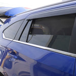 Blue car with a roof rack in a parking lot