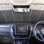 Car interior with dashboard, steering wheel, and infotainment system.