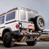 Beige off-road vehicle with large tires on a clear day