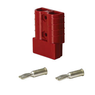 Red Anderson-style 50 amp connector housing standing upright with two silver contacts laid below it, the plus polarity mark moulded on the body