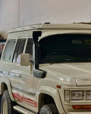 White off-road vehicle with red graphics on a white background