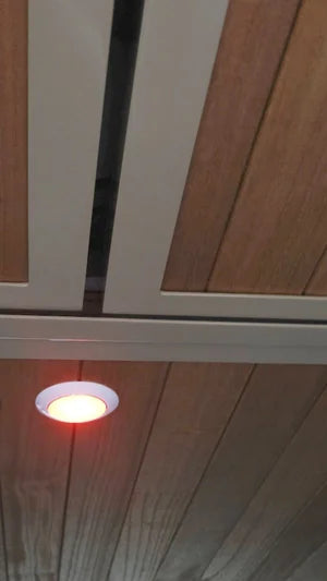 Ceiling light fixture with wooden paneling