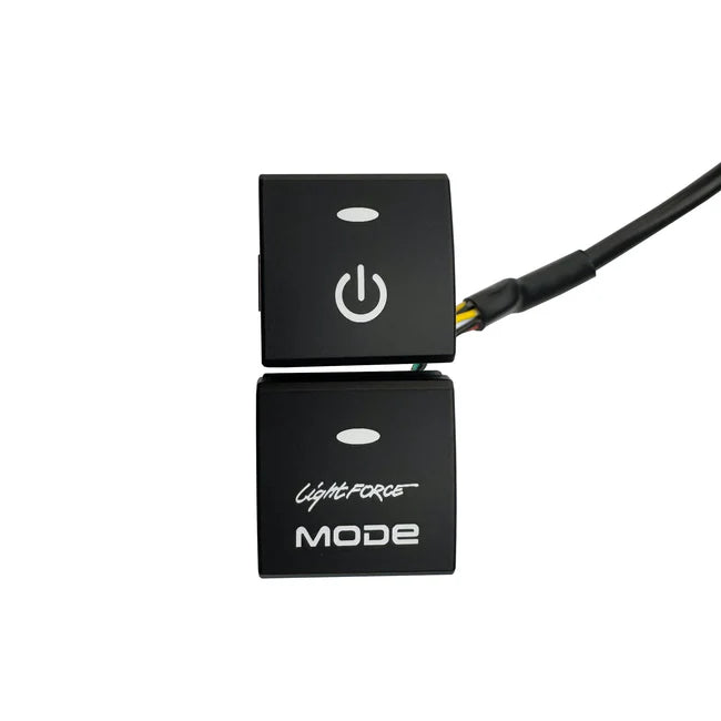 Two-position Lightforce switch blank set, an upper button with a power symbol and a lower blank carrying the Lightforce MODE name, with the wiring loom leaving the back