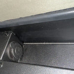 Close-up of a car door panel with a focus on the edge and trim.