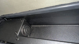 Close-up of a car door panel with a focus on the edge and trim.