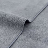 Close-up of gray textured fabric with a focus on texture and color.