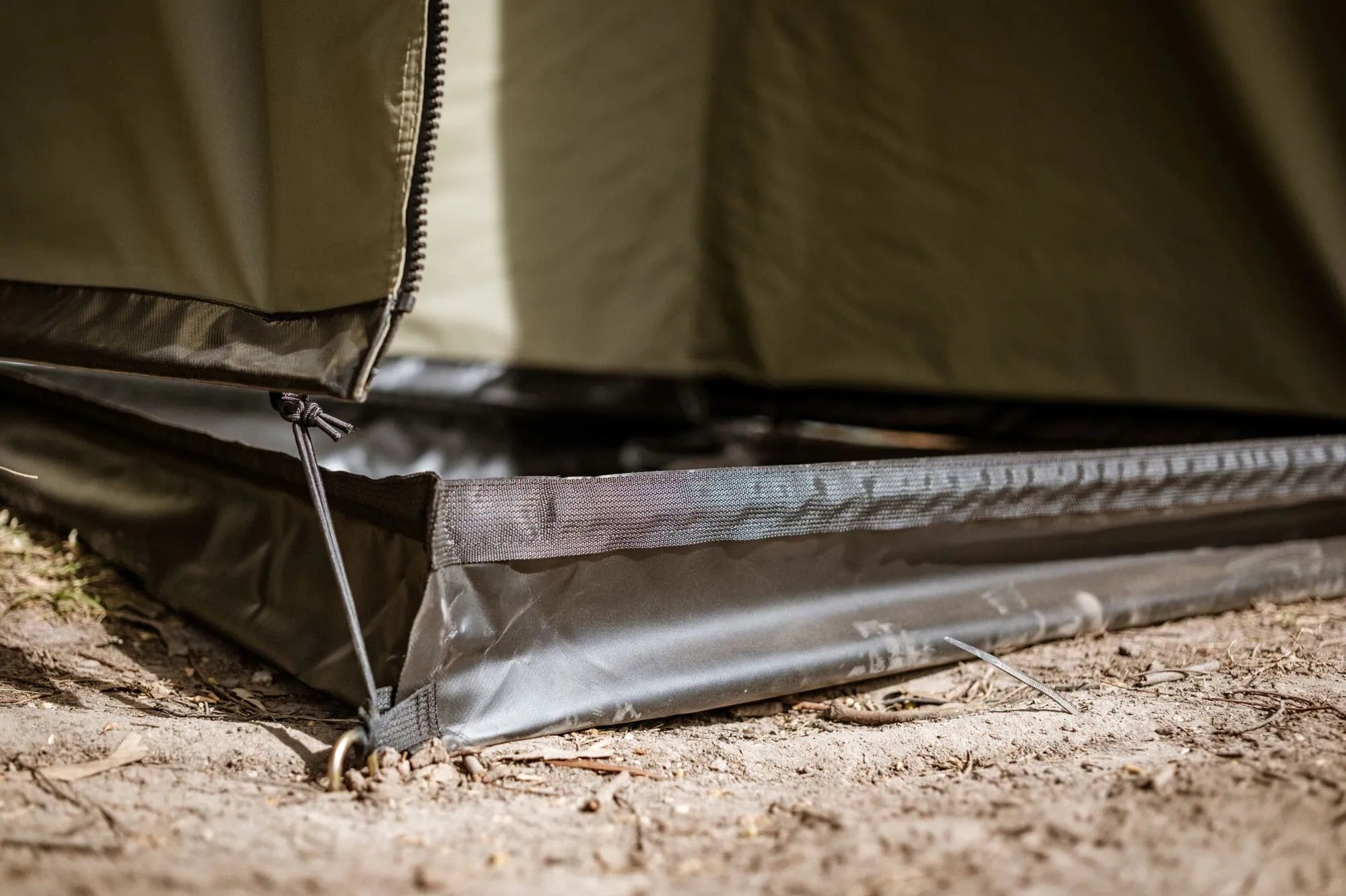 Close-up of a tent's groundsheet on a camping site