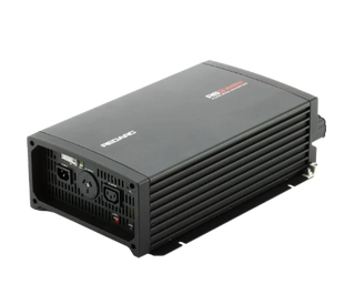 Redarc RS3 pure sine wave inverter seen from the front corner, the black finned case with the model name printed on the lid, the AC outlet and status panel at one end and the DC terminals at the other