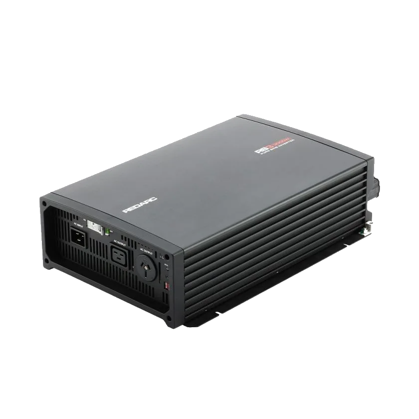 REDARC RS3 3000W inverter at an angle, showing the finned black aluminium housing and the AC panel on the front face