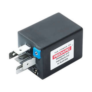 REDARC Multi Function Timer shown at an angle, with its spade terminals, blue adjustment potentiometer and two-position DIP switch visible