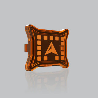 Amber rock light cover fitted over a light, the LED positions showing through the orange panel around the ALTIQ arrow in the centre