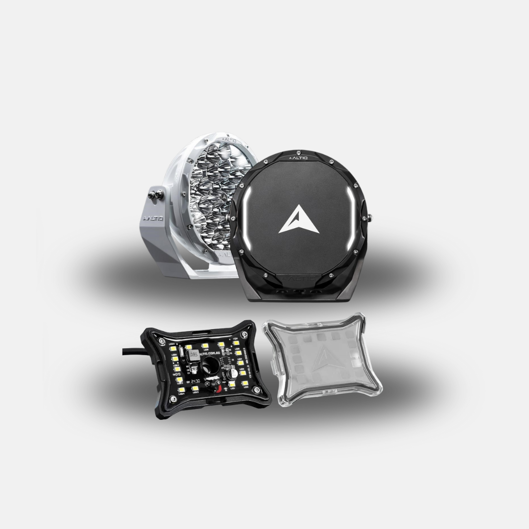 The kit shown together: a white and a black ALTIQ round driving light behind, with a long single-row hybrid light bar in front