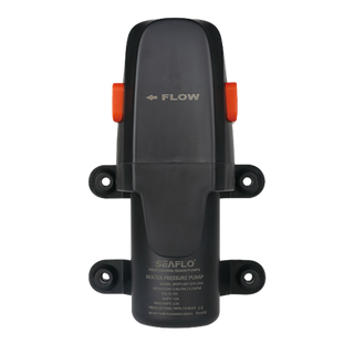 Seaflo water pressure pump seen from above, the flow arrow moulded into the cover, two orange retaining clips, and the rating panel reading model SFDP1-007-070-23A, open flow 2.65 LPM or 0.70 GPM, 12 volts, 1.2 amps with 2.5 amps maximum, pressure setting 70 PSI or 4.8 bar, and a warning not to pump flammable liquids