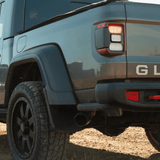 Close-up of a blue Jeep Gladiator in an outdoor setting