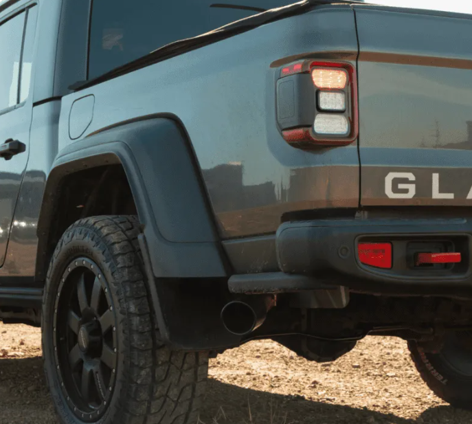 Close-up of a blue Jeep Gladiator in an outdoor setting