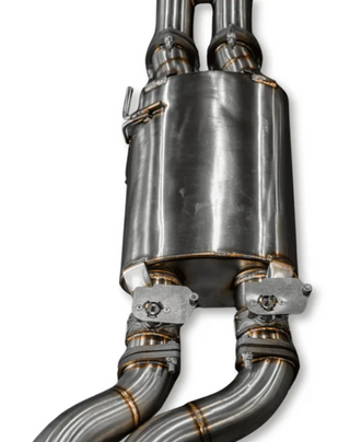 Metallic exhaust system on a white background