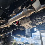 Close-up of a vehicle's undercarriage with suspension components.