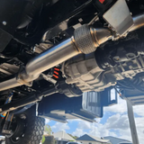 Close-up of a vehicle's undercarriage with suspension components.