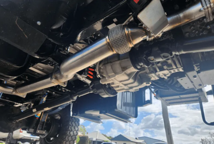 Close-up of a vehicle's undercarriage with suspension components.