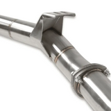 Close-up of a metallic exhaust pipe with a white background