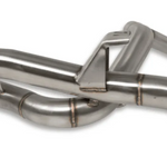 Close-up of a stainless steel exhaust system on a white background