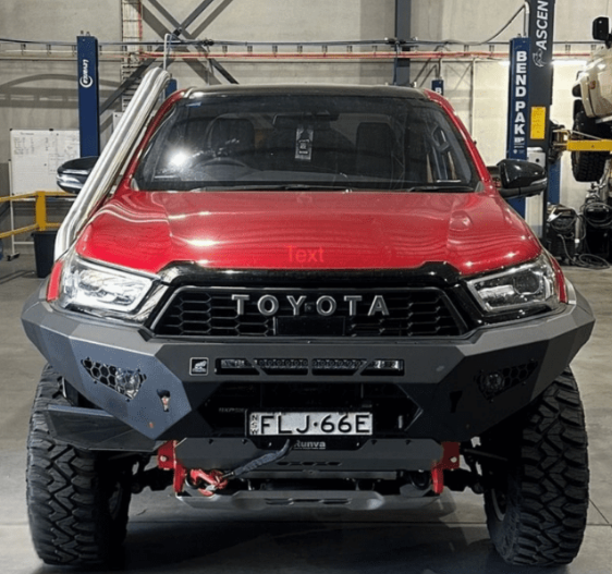 Red Toyota truck in a garage setting