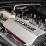 Close-up of a car engine with a prominent 'Torqit' label.