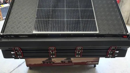 Solar panel on a black roof top tent