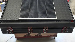 Solar panel on a black roof top tent