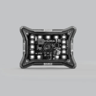 ALTIQ Spectrum Pro rock light seen square on from above, the black moulded frame around the clear lens with the LED board and its wiring visible through it