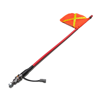The complete 1.2m whip laid out at an angle, the safety flag at the top of the red fibreglass shaft and the quick-release base with its Deutsch connector at the bottom