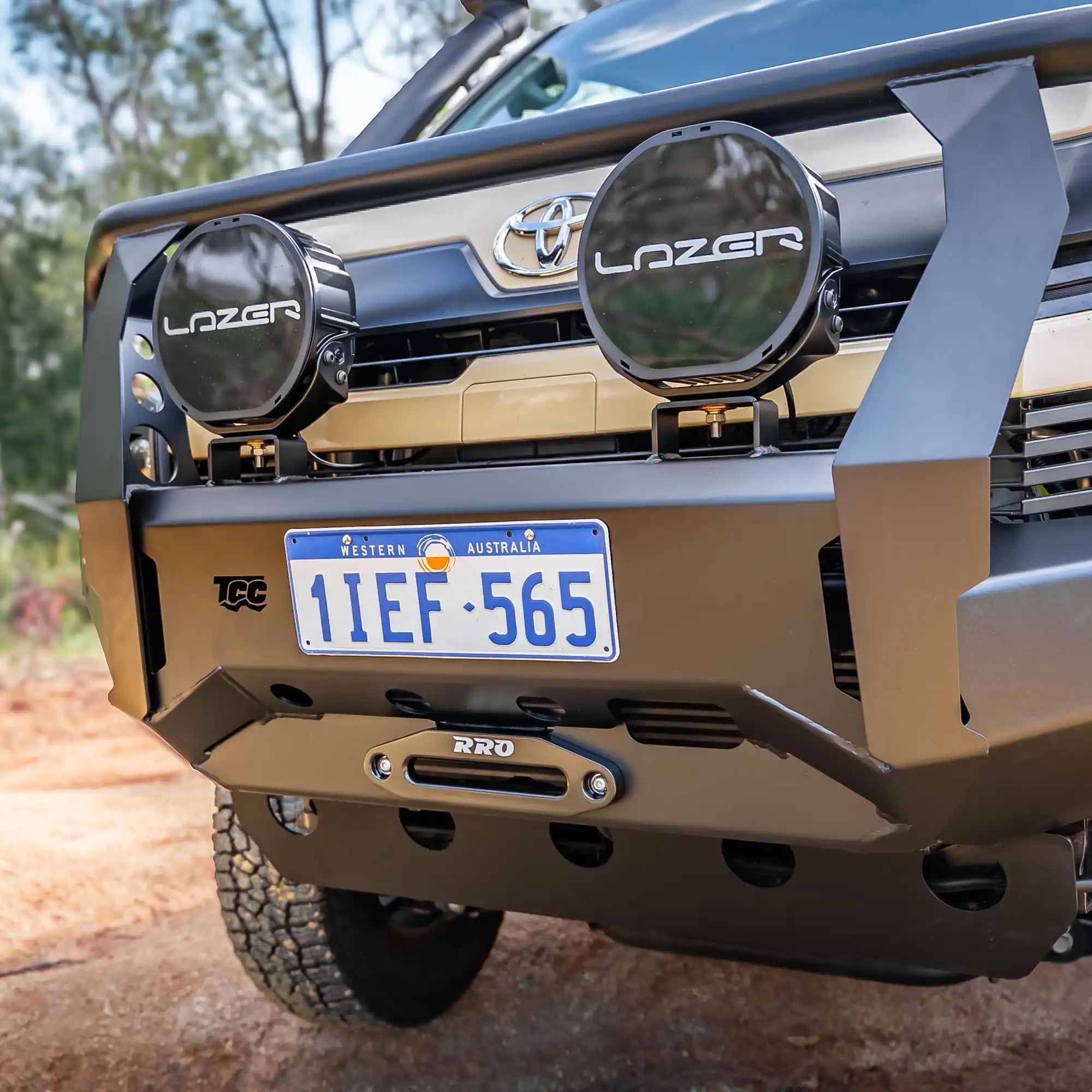 Front view of a Toyota truck with accessories and a license plate.