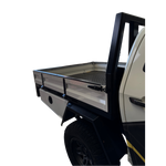 Side view of a truck with an open bed on a white background