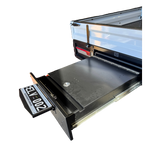 Open drawer with a metallic finish on a white background