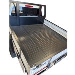 Empty truck bed with a checkered floor pattern on a white background