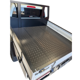 Empty truck bed with a checkered floor pattern on a white background
